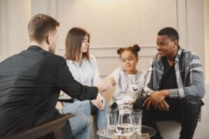 Family meeting with a professional to discuss child custody and parent sobriety in Indiana